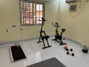 a room with two exercise bikes and a treadmill at Group stay Pangasinan in Bugallon