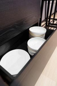 two white toilets sitting in a counter top at 燕のお宿-The Swallow's Inn- in Kumamoto +30 photos