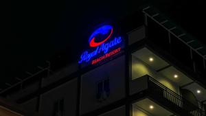 a sign on the side of a building at Royal Agate Beach Resort in Pantai Cenang
