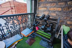 a view of a balcony with a fire grill at Tequila Sunrise Hostel Adelaide in Adelaide