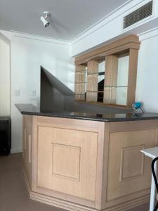 a large wooden counter top in a room at The Studio on Barberry with a Pool in Perth