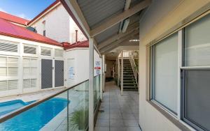 a house with a swimming pool next to a building at No 11 The Smugglers Inn in Victor Harbor