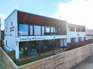a building with a balcony on the side of it at ZABOCON Yoichi Villa in Yoichi +18 photos