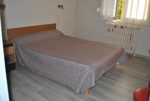 Postel nebo postele na pokoji v ubytování Le Logis Charmant