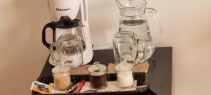 a counter with a blender and glass jars on it at Amanecer Ixtapan de la Sal in Ixtapan de la Sal