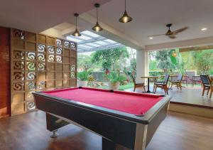 a room with a pool table in a house at FOX Hotel Jimbaran Beach Bali in Jimbaran
