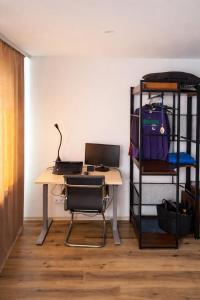 an office with a desk with a laptop and a bunk bed at Balvi Ezera Street in Balvi