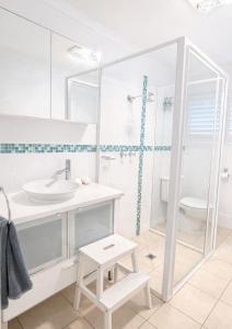 a white bathroom with a sink and a shower at St Helens in Edithburgh +13 photos