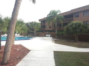 a resort with a swimming pool and a building at Charlotte Bay Resort in Port Charlotte