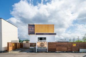 a building with a large scoreboard on the side of it at ZABOCON Yoichi Villa in Yoichi
