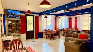 a living room with red white and blue walls at Motel Dareon in Náchod