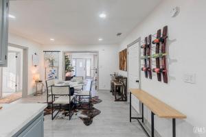 a kitchen and dining room with a table and chairs at Luxury Stay Near Downtown Bakersfield in Bakersfield