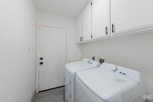 a white laundry room with a washer and dryer at Luxury Stay Near Downtown Bakersfield in Bakersfield +9 photos