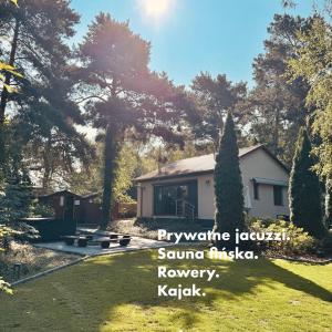 a house in a yard with the wordsplayabwe feudal samurai samurai samuraiivanemetery at Dom Blisko Natury Brenno in Brenno