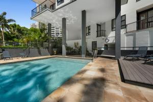 a swimming pool in the backyard of a house at Neptune Resort in Gold Coast