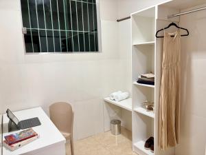a white room with a desk and a window at Julietta House Hotel in Manaus +21 photos