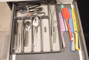 a tray of utensils sitting on a table at Modern Comfort in Calgary +9 photos