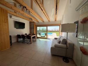 a living room with a couch and a table at Capo House in Gračišče