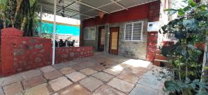 an outside view of a building with a door at Leela villa - Ancient Redstone Escape in Panchgani