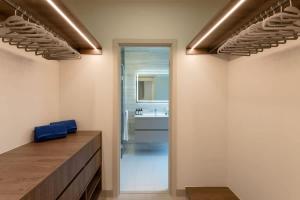 a bathroom with a sink and a mirror at Deluxe Loft Apt with City View in Panama City