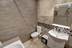 a bathroom with a toilet and a sink at Contrast LuxApart 3 min MC Casino in Beausoleil
