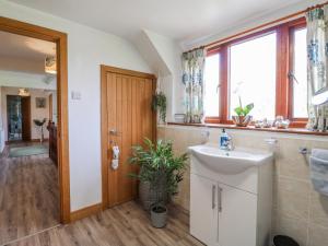a bathroom with a sink and a window at Fields Farm in Draycott in the Moors +51 photos