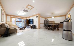 a large living room with a dining and living room at Manwol Hotel Yuseong in Daejeon