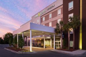 a rendering of the front of a building at Home2 Suites By Hilton Jacksonville Airport in Jacksonville