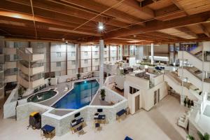 an aerial view of an apartment building with a pool at Wyndham DFW Airport in Irving