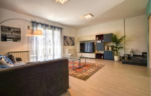 a living room with a couch and a table at Maison De Paris in San Giovanni la Punta