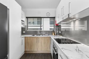 a kitchen with a sink and a counter top at Ocean Spray 5 in Coffs Harbour