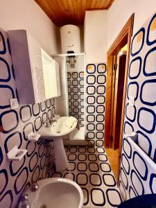 a bathroom with a sink and a toilet at Casa Barbara in Sant Arcangelo +46 photos