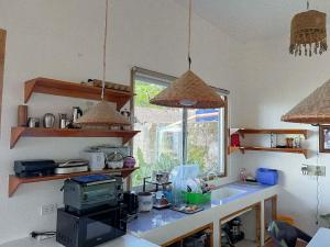 a kitchen with a sink and a counter top at Durano Seaside Retreat in Mercedes +13 photos