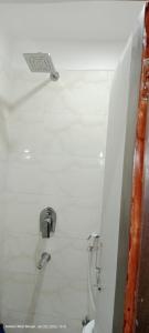 a bathroom with a sink and a toilet at Hotel royale in Kolkata