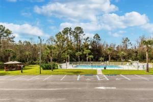 an empty parking lot with a swimming pool at Econo Lodge Lake City-North in Lake City