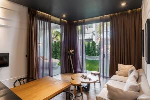 a living room with a couch and a table at White Boutique Hotel and Restaurant in Sihanoukville