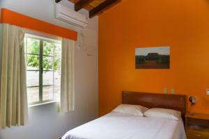 Ένα ή περισσότερα κρεβάτια σε δωμάτιο στο Hotel Serra Verde