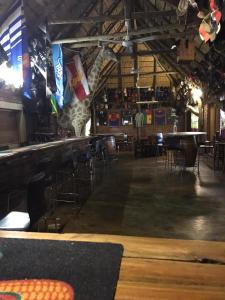 a bar with chairs and tables in a room at Lapa Lê Lê Lodge in Ellisras +9 photos