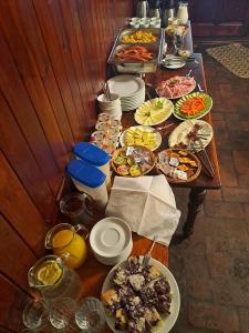 a long table with many plates of food on it at Penzion Na Louži in Český Krumlov