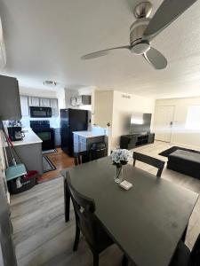 a living room with a dining room table and a kitchen at Renovated Downtown Phoenix Condo in Phoenix