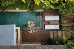 a rendering of a room with a slice of pizza at Sanora Villa Sanur by Ini Vie Hospitality in Sanur