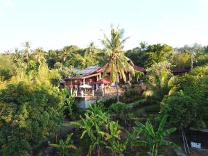 an aerial view of a resort with palm trees at Sanshikirana House Lovina in Lovina