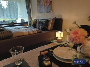 a living room with a couch and a window at Fewo Eisvogelnest in Sankt Englmar