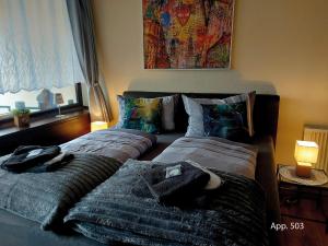 two beds sitting next to each other in a bedroom at Fewo Eisvogelnest in Sankt Englmar