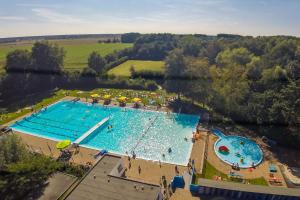 an overhead view of a large swimming pool at Huis van Marietje in Aardenburg