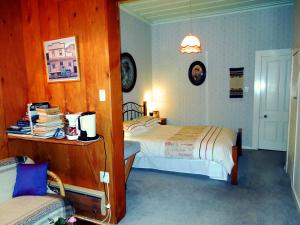 Llit o llits en una habitació de Mairenui Rural Retreat