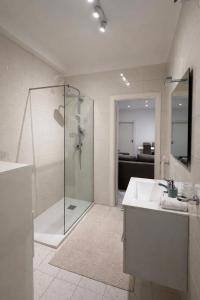 a bathroom with a shower and a sink at The Urban Lodge in Bari