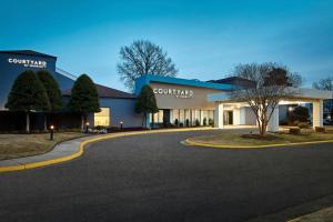 a building with a curvy road in front of it at Courtyard Virginia Beach Norfolk in Virginia Beach