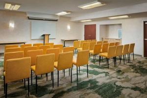 a conference room with chairs and a board in it at Courtyard Virginia Beach Norfolk in Virginia Beach +14 photos