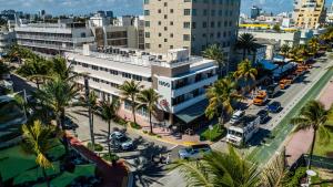 an aerial view of a city with palm trees and buildings at Hotel Casa Canita in Miami Beach